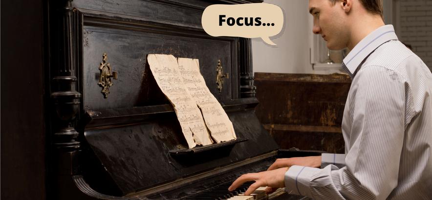 Young man at piano says "Focus"